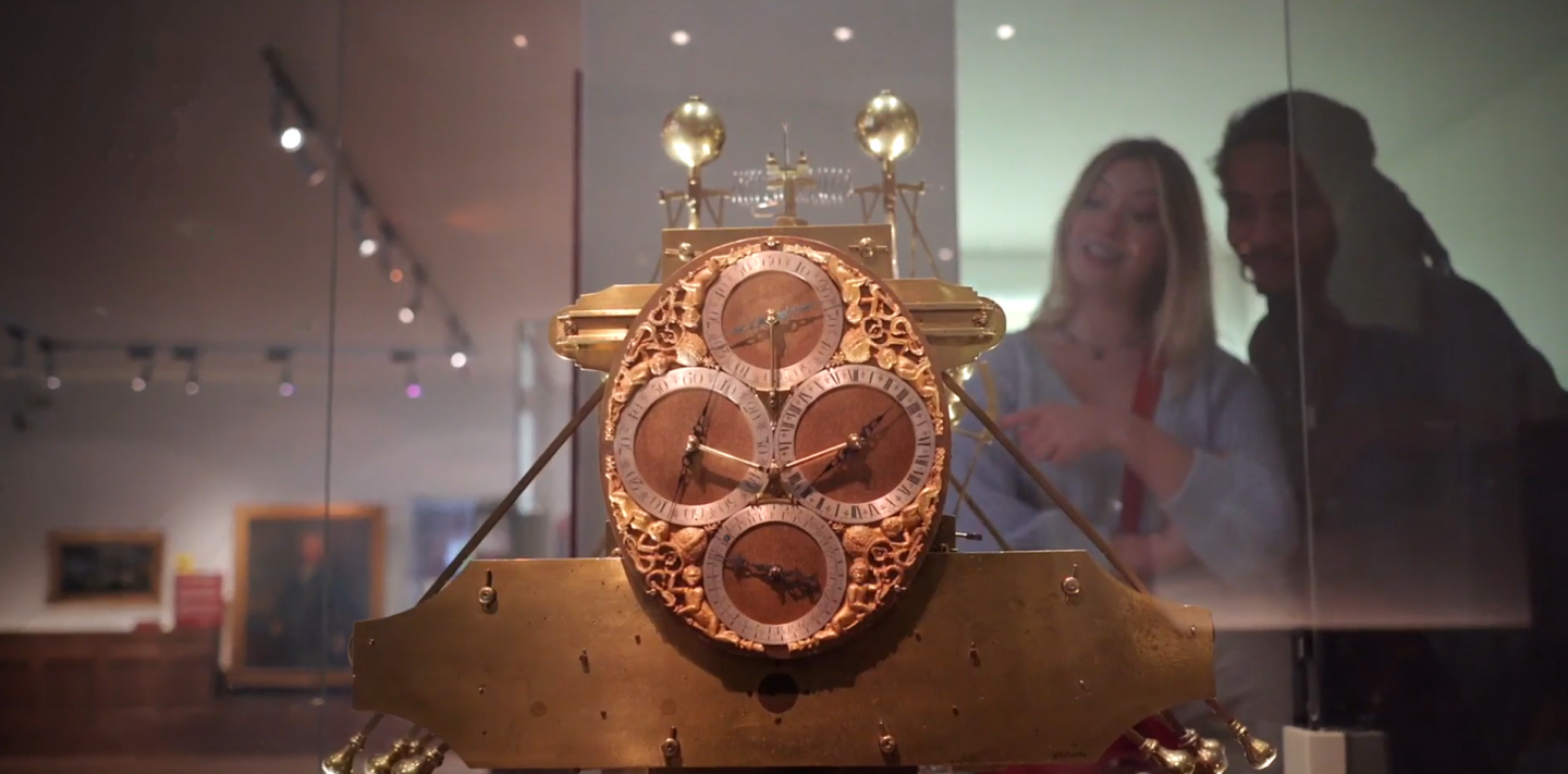 Man and woman looking at Harrison's clocks